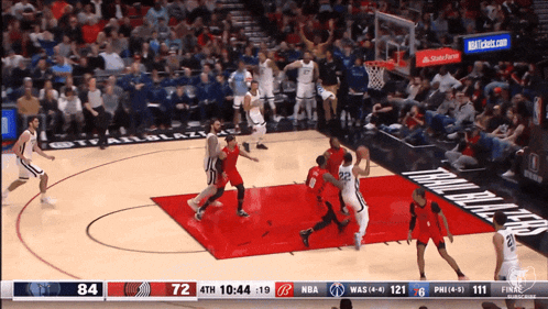 a basketball game is being played in front of a crowd