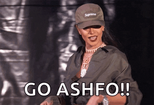 a woman wearing a hat that says supreme says go ashfo