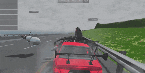 a computer screen shows a red car crashing into a black car
