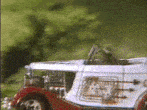 a red and white toy car with the word hot rod on the side of it