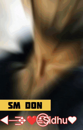 a blurry picture of a person 's neck with sm don and sidhu written on the bottom