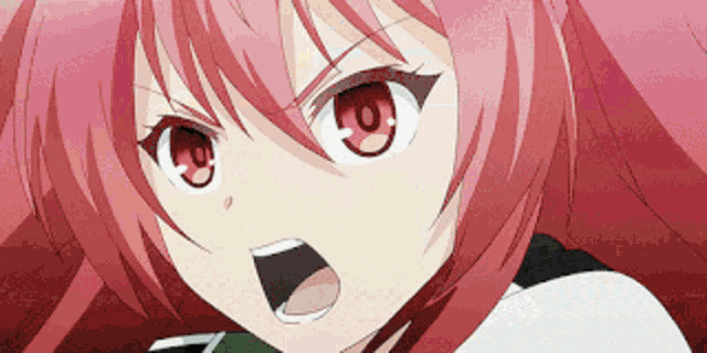 a close up of a girl 's face with red hair and red eyes