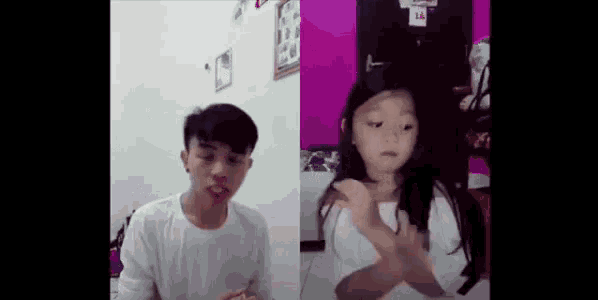 a man and a little girl are dancing together in a room .