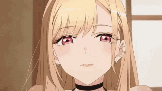 a close up of a blonde anime girl with red eyes and earrings