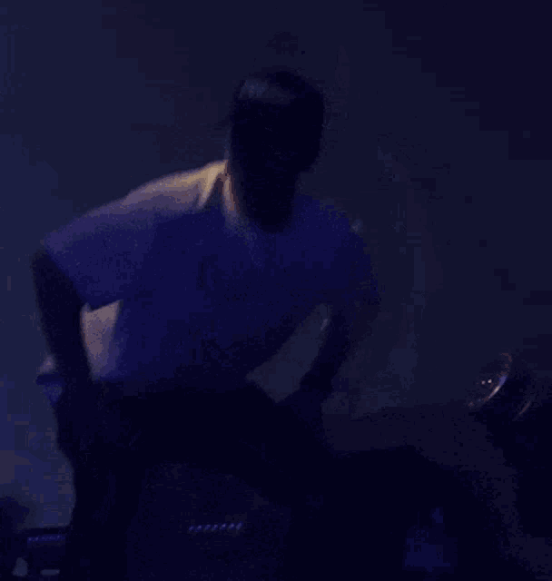 a man wearing a shirt that says " do n't " is dancing