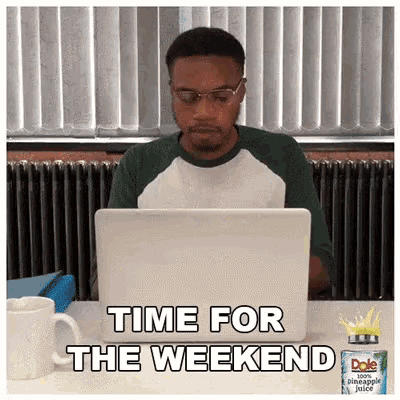 a man is sitting at a desk with a laptop and the words time for the weekend