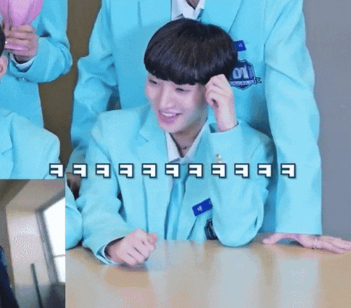 a boy in a blue jacket with the number 01 on his jacket