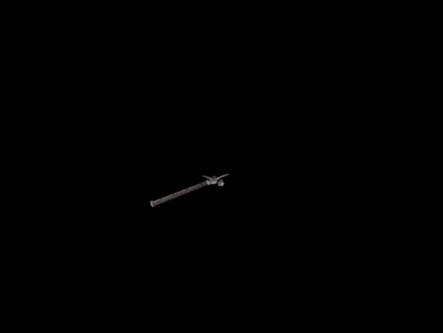 a red object with a yellow circle around it is floating in the air