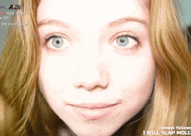 a close up of a girl 's face with the words " i will slap molly " on the bottom