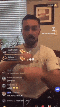 a man wearing a white shirt with the word fresh on it is talking on a live stream