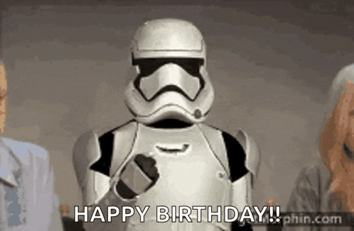 a storm trooper is giving a thumbs up and says happy birthday .