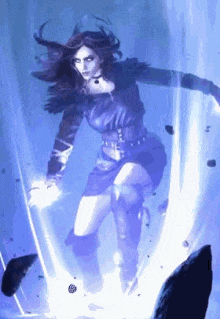 a woman in a purple dress is standing in a dark room