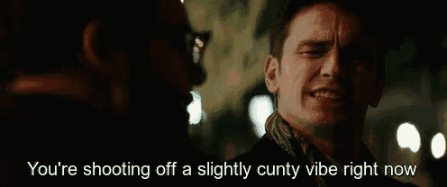 a man is crying with the words you 're shooting off a slightly cunty vibe right now above him .