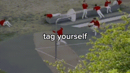 a group of people are doing a stunt on a basketball court and the words tag yourself are above them