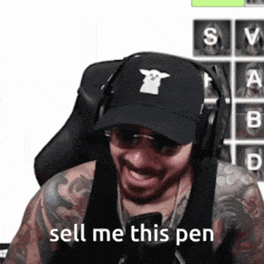 a man wearing headphones and a black hat says sell me this pen