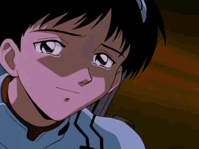 a close up of a person 's face with a tear running down their cheek