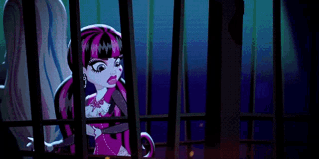 draculaura monster high doll behind bars with a purple tentacle coming out of her mouth