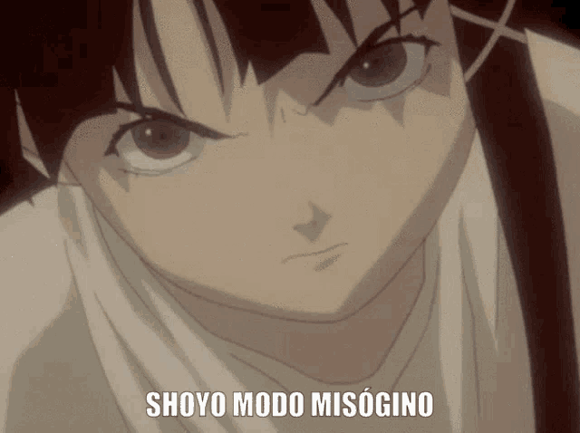 a close up of a girl 's face with the words shoyo modo misogino above her