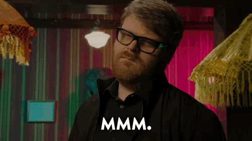 a man with glasses and a beard says you look delicious .
