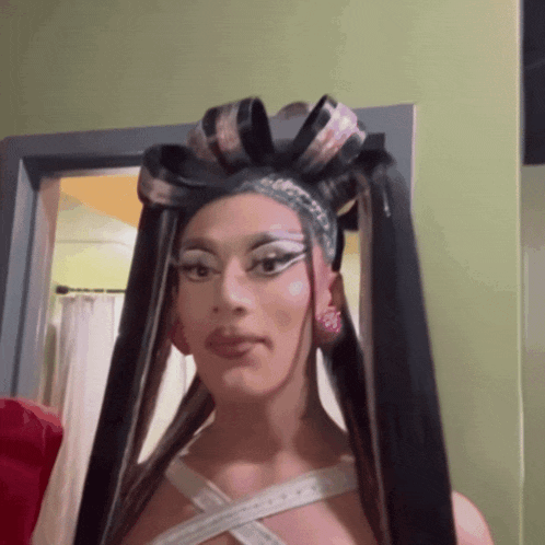 a woman with very long hair and a bow in her hair