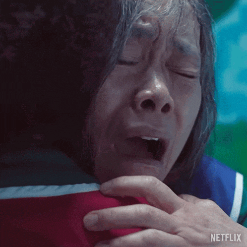 a close up of a woman 's face with a netflix logo on the bottom