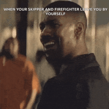 a man in a black jacket says " ok " in front of a group of people