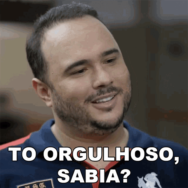 a man with a beard is smiling with the words to orgulloso sabia below him