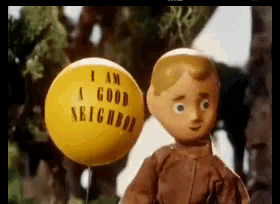 a yellow balloon that says i am a good neighbor