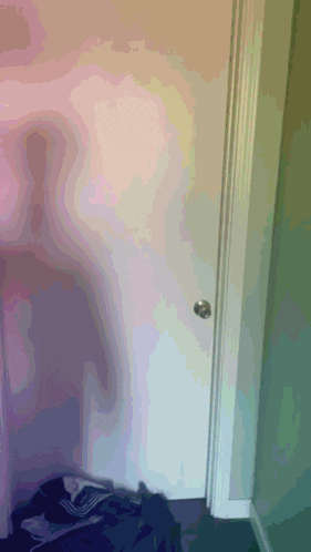 a door with a shadow of a person on the wall