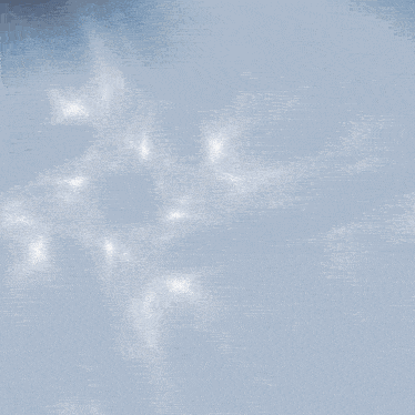a blurred image of a gold ring on a white background