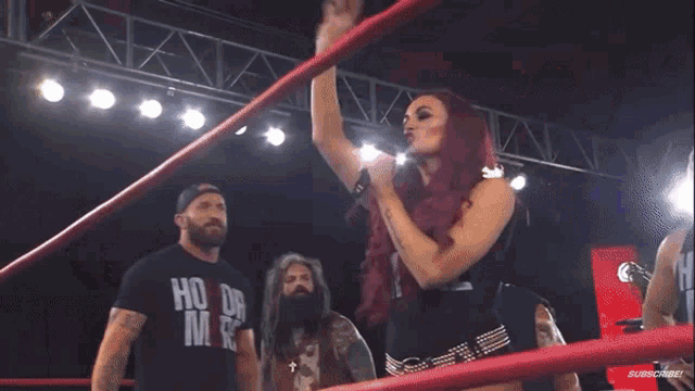 a woman in a wrestling ring singing into a microphone with the words your too sweet can go right here below her