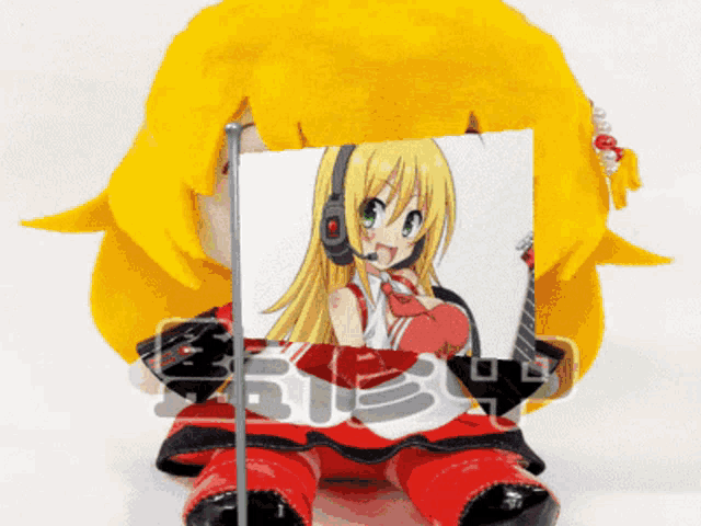 a stuffed doll with a picture of a girl with headphones and the word ruby on the bottom