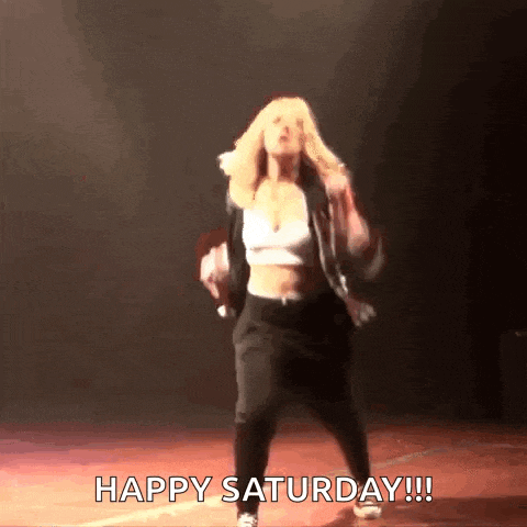 a woman is dancing on a stage and the caption says happy saturday !!!