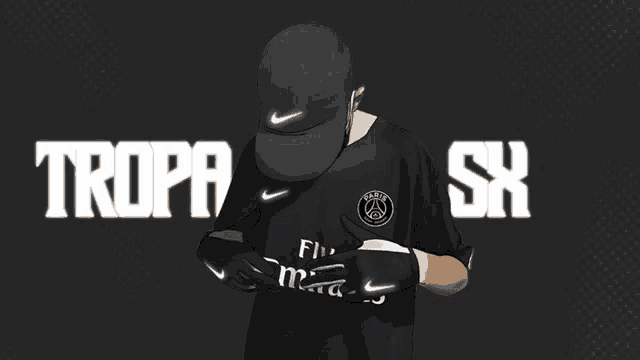 a man wearing a nike hat and gloves is standing in front of the word tropa sk