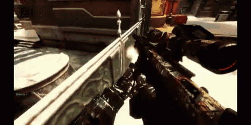 a person holding a rifle in a video game with a username that starts with the letter t.