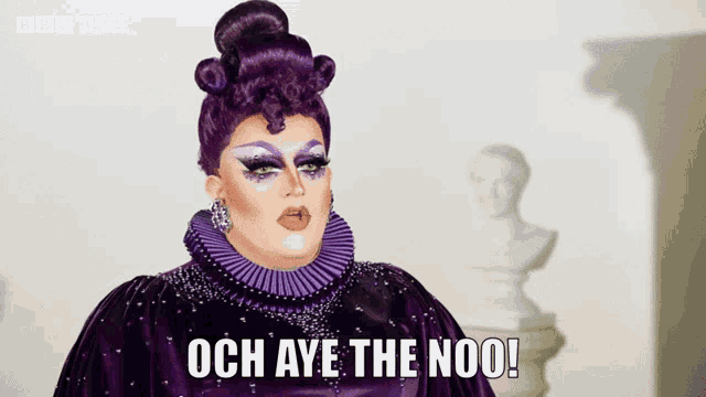 a drag queen says och aye the noo while wearing a purple dress