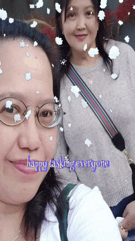 two women standing next to each other with the words happy tasking everyone on the bottom right