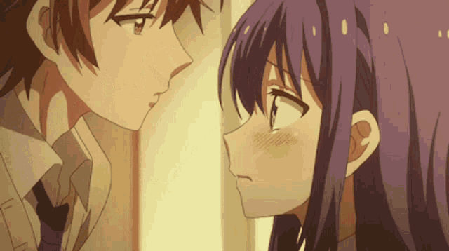 a boy and a girl are kissing in a cartoon