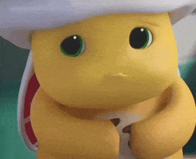 a yellow cartoon character with green eyes and a white hat