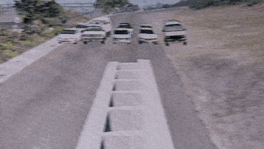a computer generated image of a highway with cars driving down it