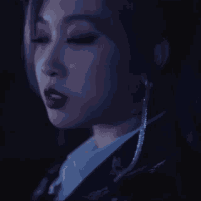 a close up of a woman 's face with red lips