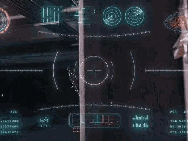 a man in a black leather jacket is standing in front of a screen with numbers and a target