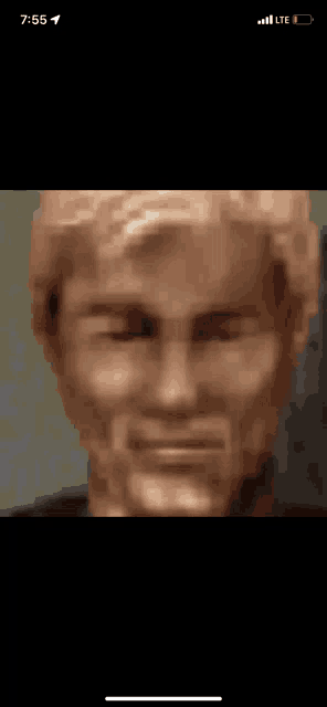 a close up of a statue of a man with his eyes closed .