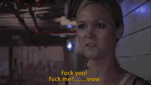 a man and a woman are standing next to each other and the woman is saying " fuck you "