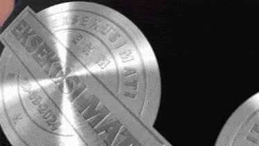 a close up of a metal sticker that says " eksekusi mati "