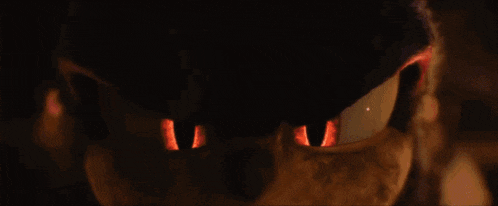 a close up of a sonic the hedgehog 's eyes in a dark room .