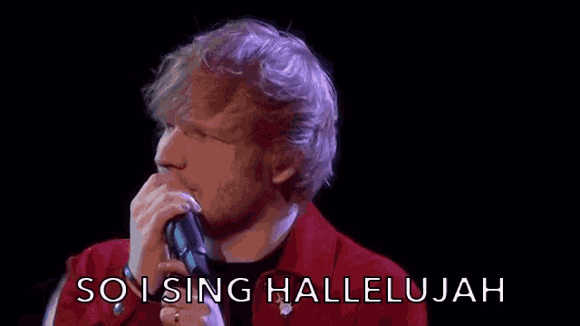 a man singing into a microphone with the words so i sing hallelujah written below him