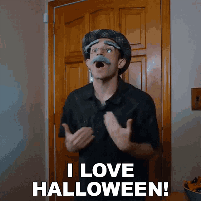 a man in a hat and mustache says i love halloween