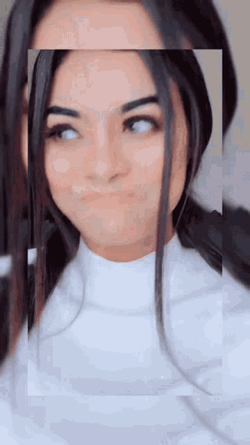 a woman making a funny face with her eyes closed