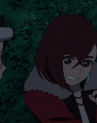 a girl in a red jacket holds her finger to her lips